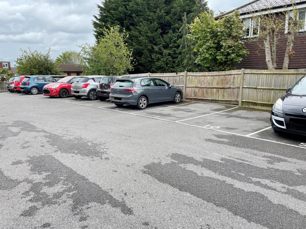 Lot: 82 - VACANT FLAT WITH PARKING IN TOWN CENTRE - view of parking area showing allocated space for flat 12